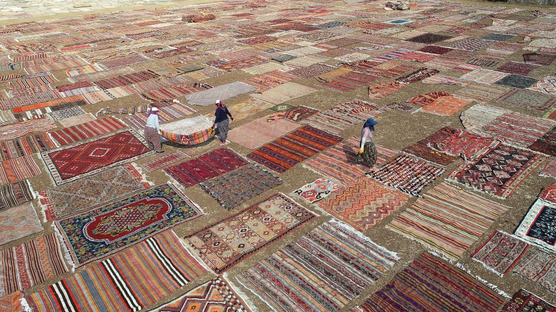 <strong>Antalya, Turkey: </strong>Hand-knotted carpets are spread out in the sunshine in order to soften the color of their dyes. 