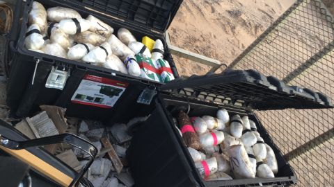 Police found drugs inside containers that apparently came through the tunnel.