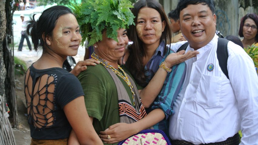 Festival goers and dancers pose for a photo during the annual Spirit Festival in Myanmar's Taung Byone village.