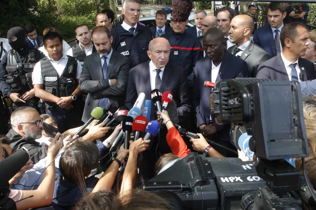 French Interior Minister Gerard Collomb addresses reporters after a knife attack Thursday in Trappes.