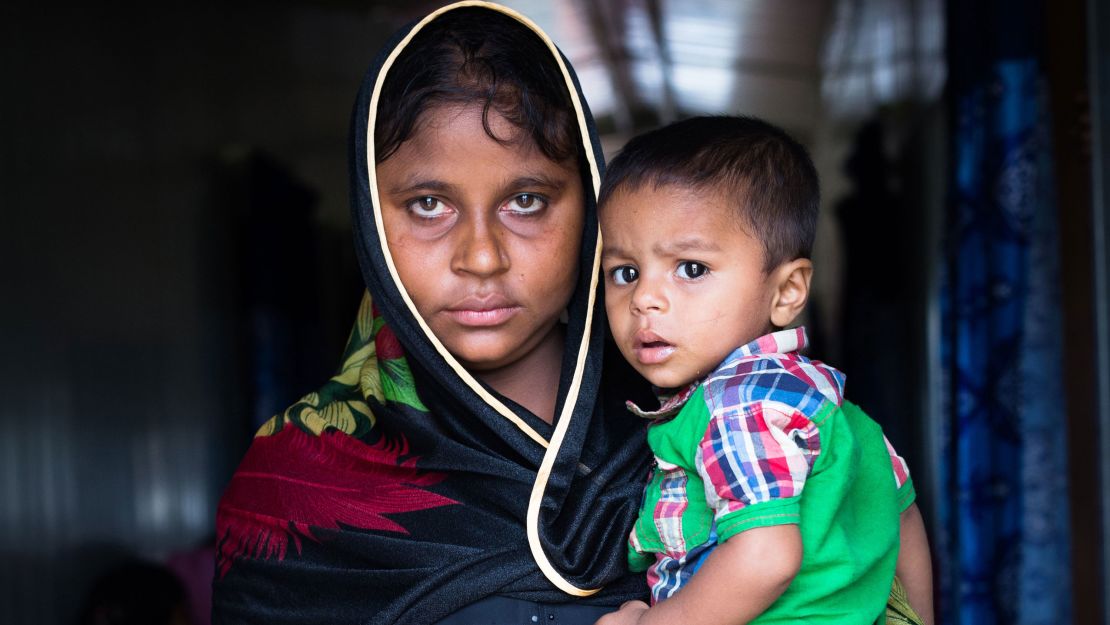 Samuda, a 25-year old refugee, with her son, who was born just one day before she was raped by men dressed in Myanmar military uniforms. The two fled into Bangladesh not long after the attack. 