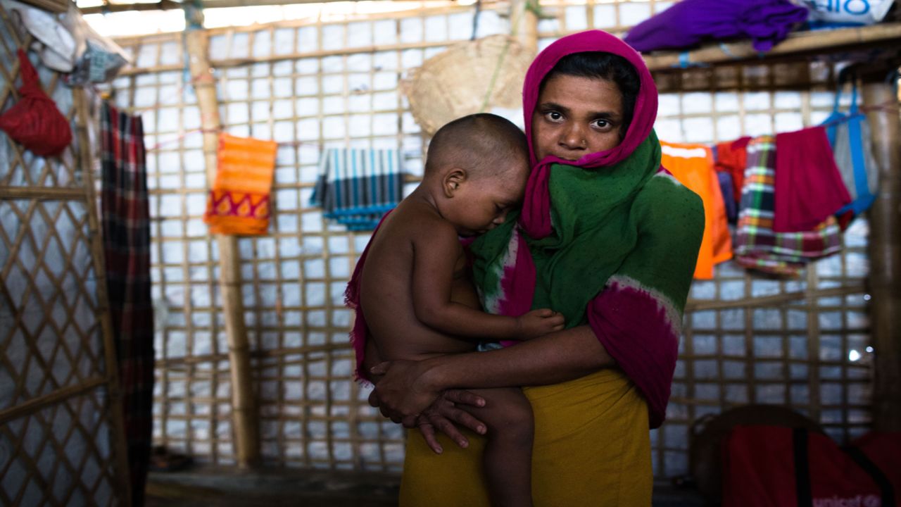 Dildef, with her 2-year old son. She hasn't yet told her husband she was raped.