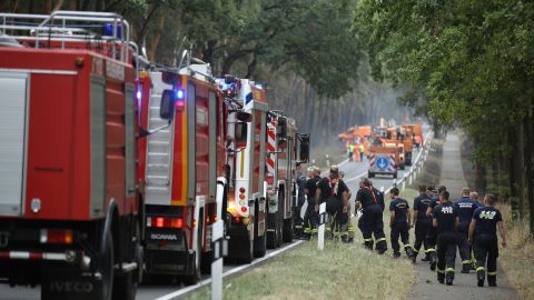 Firefighters arrive to help extinguish a burning section of forest in southern Brandenburg on Friday.