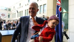 Australia's incumbent Prime Minister Malcolm Turnbull leaves a press conference with his granddaughter Alice after a party meeting in Canberra on August 24, 2018. - Scott Morrison was installed as Australia's seventh prime minister in 11 years on August 24 after a stunning Liberal party revolt instigated by hardline conservatives unseated moderate Malcolm Turnbull. (Photo by SAEED KHAN / AFP)        (Photo credit should read SAEED KHAN/AFP/Getty Images)