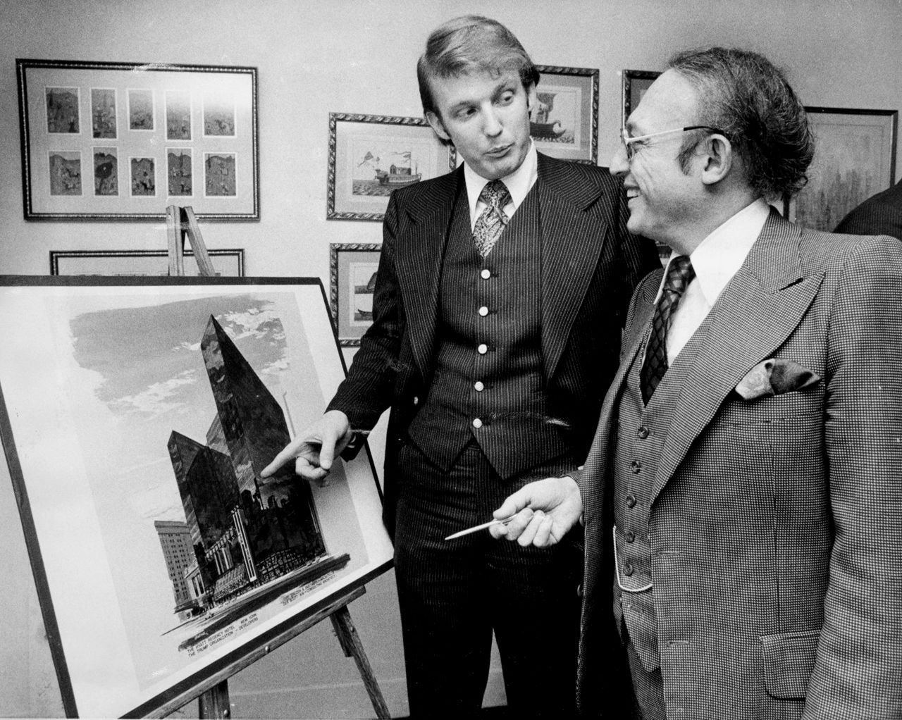 Trump stands with Alfred Eisenpreis, New York's economic development administrator, in 1976 while they look at a sketch of a new 1,400-room renovation project of the Commodore Hotel. After graduating from college in 1968, Trump worked with his father on developments in Queens and Brooklyn before purchasing or building multiple properties in New York and Atlantic City, New Jersey. Those properties included Trump Tower in New York and Trump Plaza and multiple casinos in Atlantic City.