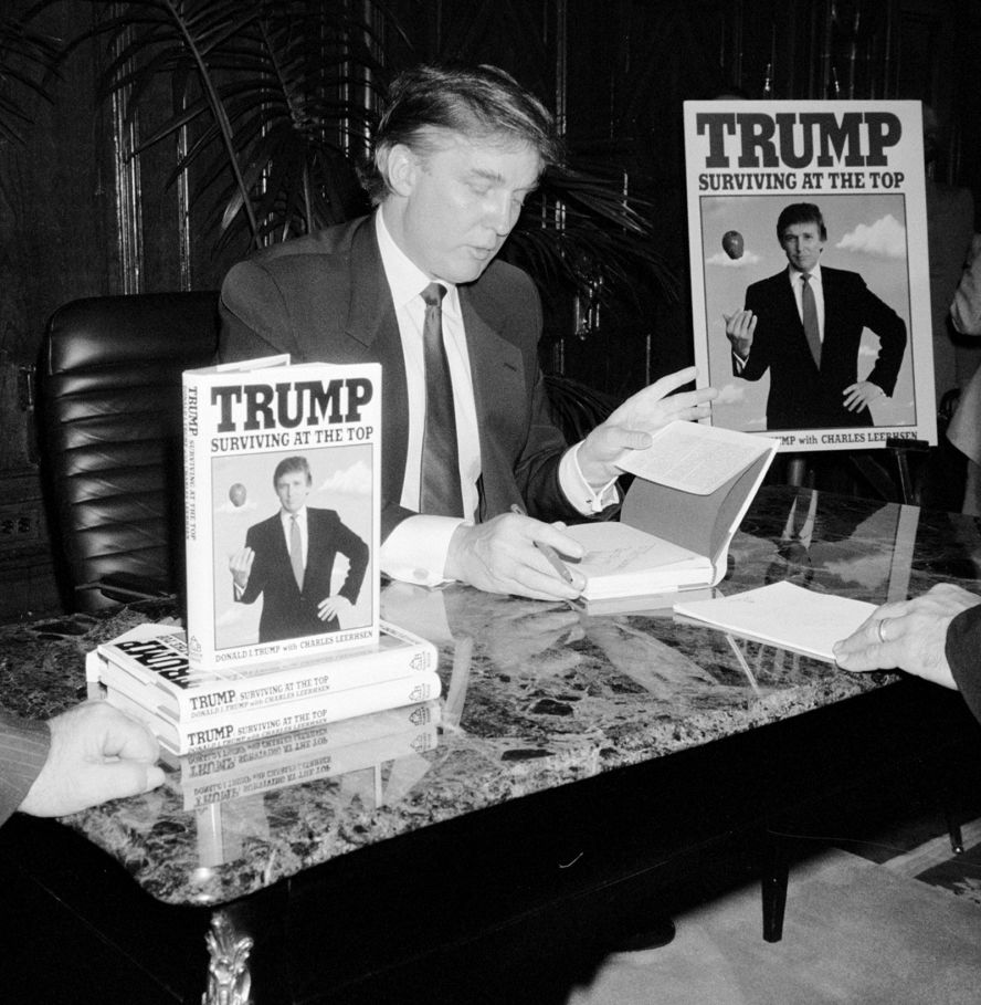 Trump signs his second book, "Trump: Surviving at the Top," in 1990. Trump <a href="http://www.trump.com/publications/" target="_blank" target="_blank">has published</a> at least 16 other books, including "The Art of the Deal" and "The America We Deserve."