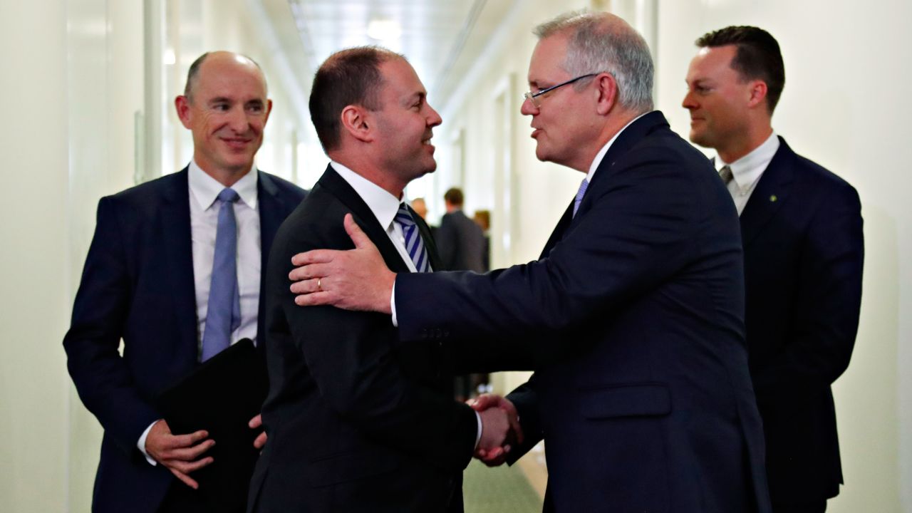 Australia's incoming Prime Minister Scott Morrison (2nd R) is congratulated by his new deputy Josh Frydenberg (2nd L) after a party meeting in Canberra on August 24.