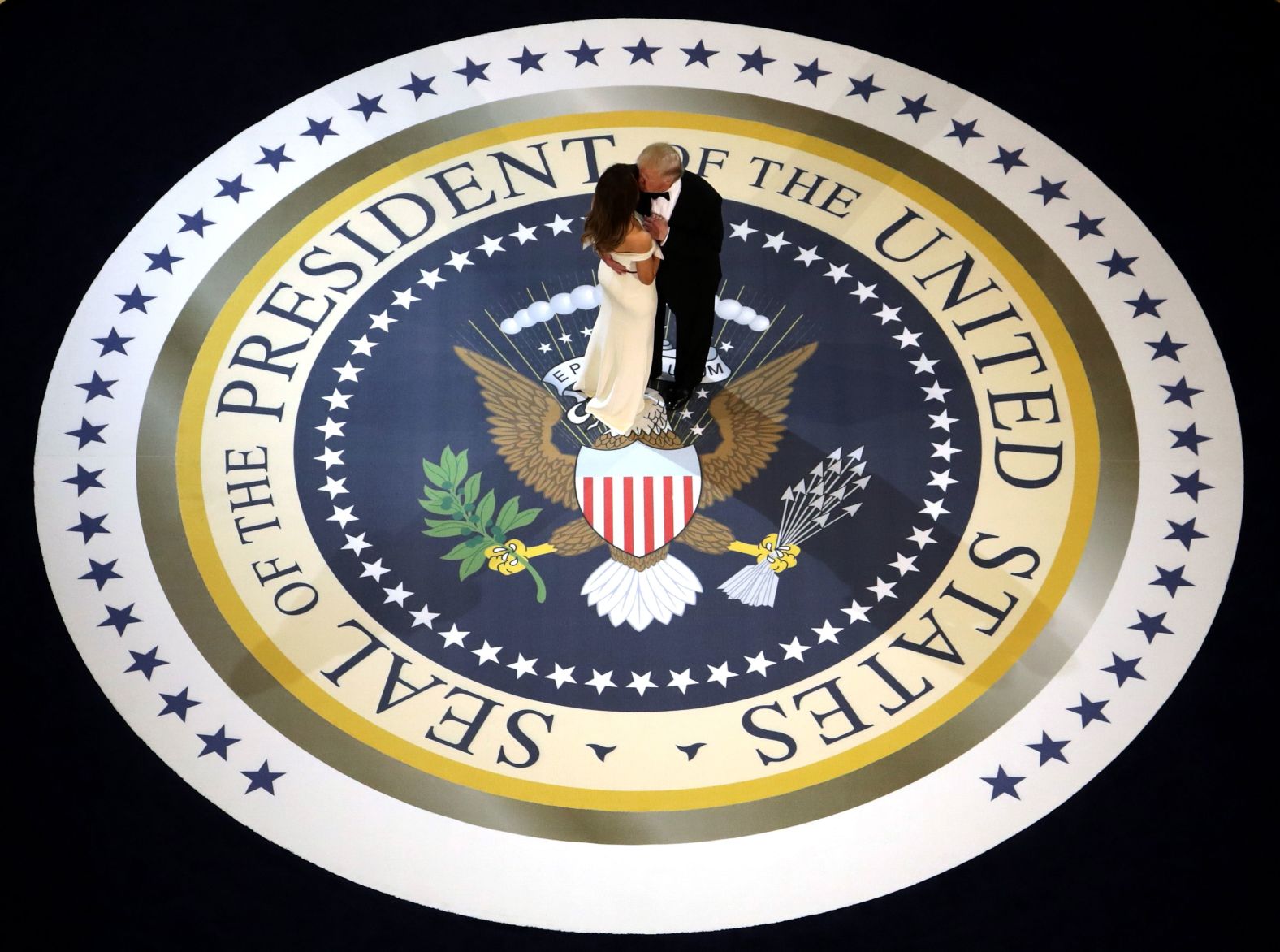 The new president kisses the first lady as they dance at one of <a href="index.php?page=&url=http%3A%2F%2Fwww.cnn.com%2F2017%2F01%2F20%2Fpolitics%2Fgallery%2F2017-inaugural-balls%2F" target="_blank">three inaugural balls.</a> The president, known for his affinity of over-the-top gold fixtures, <a href="index.php?page=&url=http%3A%2F%2Fwww.cnn.com%2F2017%2F01%2F20%2Fpolitics%2Finaugural-ball-melania-trump-fashion-2017%2F" target="_blank">went for classic Americana</a> with a touch of retro glitz.