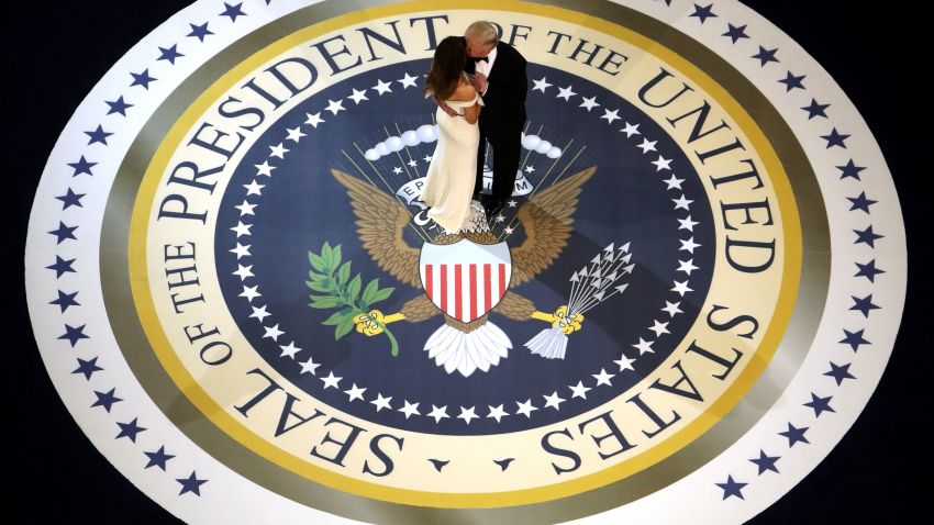 WASHINGTON, DC - JANUARY 20:  President Donald Trump and his wife First Lady Melania Trump kiss and dance on stage during A Salute To Our Armed Services Inaugural Ball at the National Building Museum on January 20, 2017 in Washington, DC. President Donald Trump was sworn in as the 45th President of the United States today.  (Photo by Alex Wong/Getty Images)