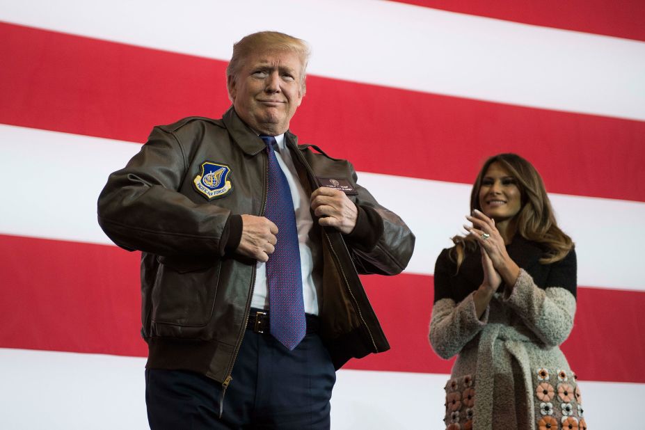 Trump, accompanied by the first lady, puts on a bomber jacket that he received from US forces in Tokyo in November 2017. Trump was on <a href=