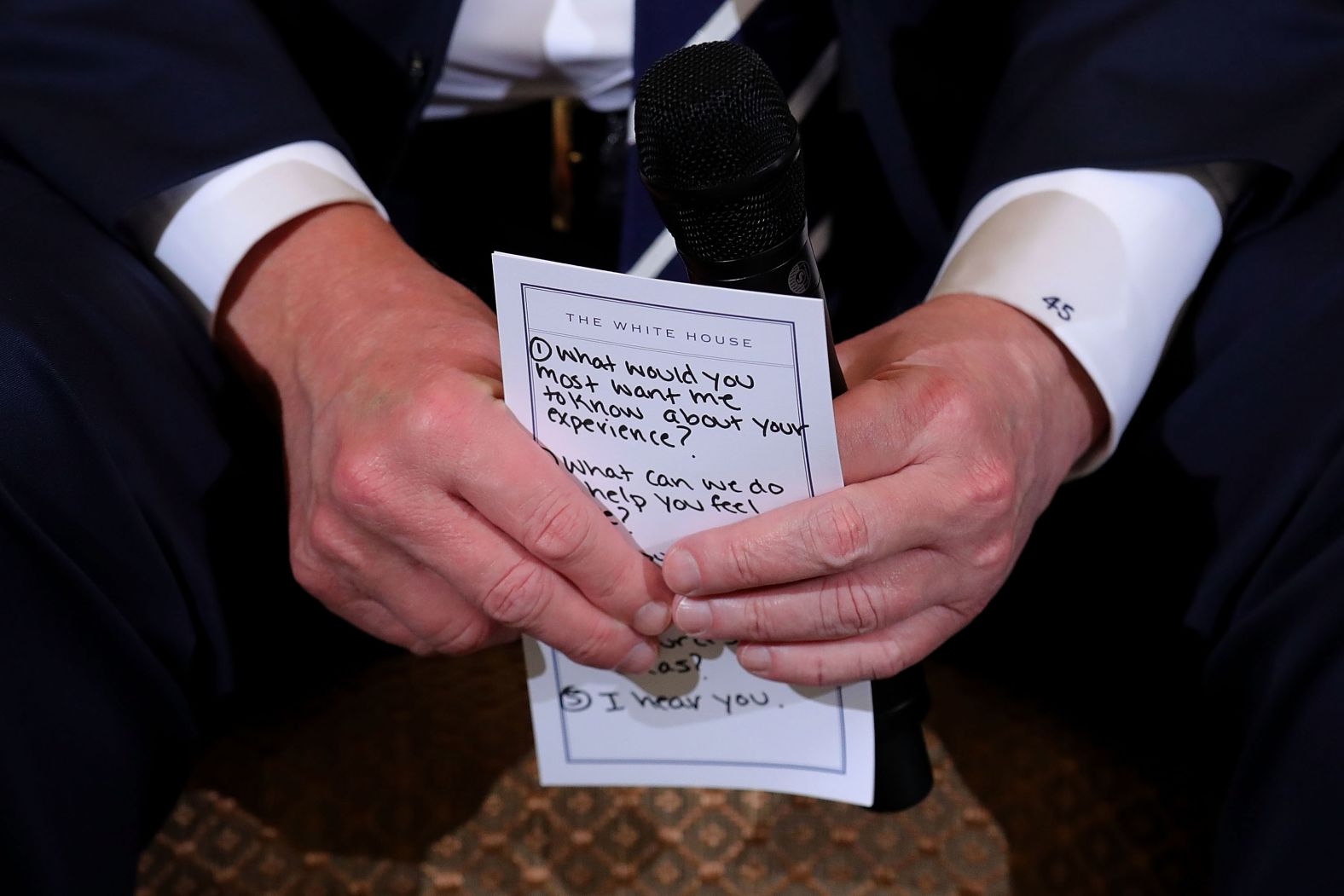 Trump holds his notes while hosting a <a href="index.php?page=&url=https%3A%2F%2Fwww.cnn.com%2F2018%2F02%2F21%2Fpolitics%2Ftrump-listening-sessions-parkland-students%2Findex.html" target="_blank">listening session with student survivors</a> of mass shootings, their parents and teachers in February 2018. The <a href="index.php?page=&url=https%3A%2F%2Fwww.cnn.com%2F2018%2F02%2F21%2Fpolitics%2Ftrump-parkland-notecard%2Findex.html" target="_blank">visible points included prompts</a> such as "1. What would you most want me to know about your experience?" "2. What can we do to help you feel safe?" and "5. I hear you."