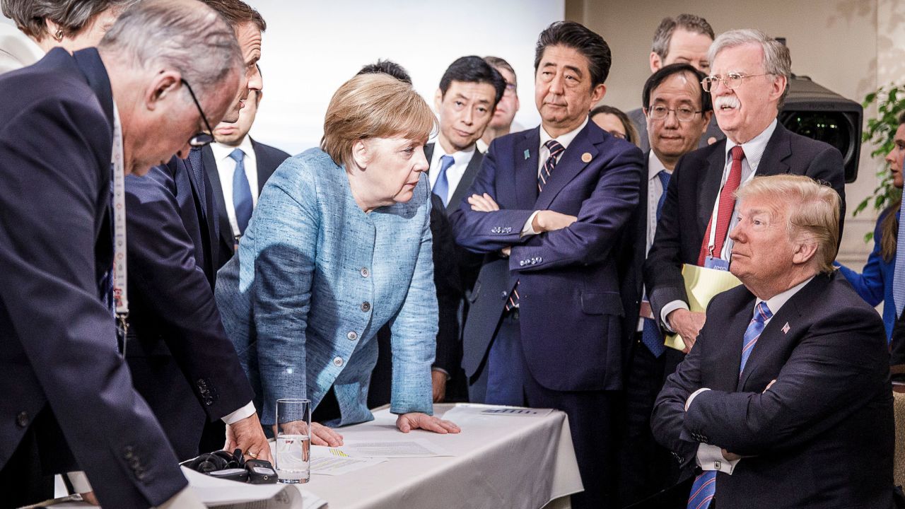 Merkel deliberates with US president Donald Trump on the sidelines of the official agenda on the second day of the G7 summit on June 9, 2018 in Charlevoix, Canada.