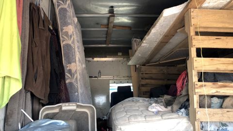 Makeshift living quarters in a box truck remain on the compound.