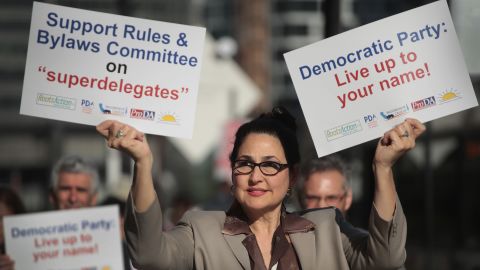 CHICAGO, IL - AUGUST 23: Demonstrators protest outside the Hyatt Hotel where the Democratic National Committee (DNC) were kicking off their summer meeting on August 23, 2018 in Chicago, Illinois. The demonstrators were protesting the use of superdelegates by the Democratic party, which is one of the issues to be addressed at the meeting. During the meeting the DNC is also expected to address other issues of concern in their presidential nominating process as well as lay out plans for getting out the vote during the mid-term election and taking steps toward picking a city to host the 2020 convention. (Photo by Scott Olson/Getty Images)