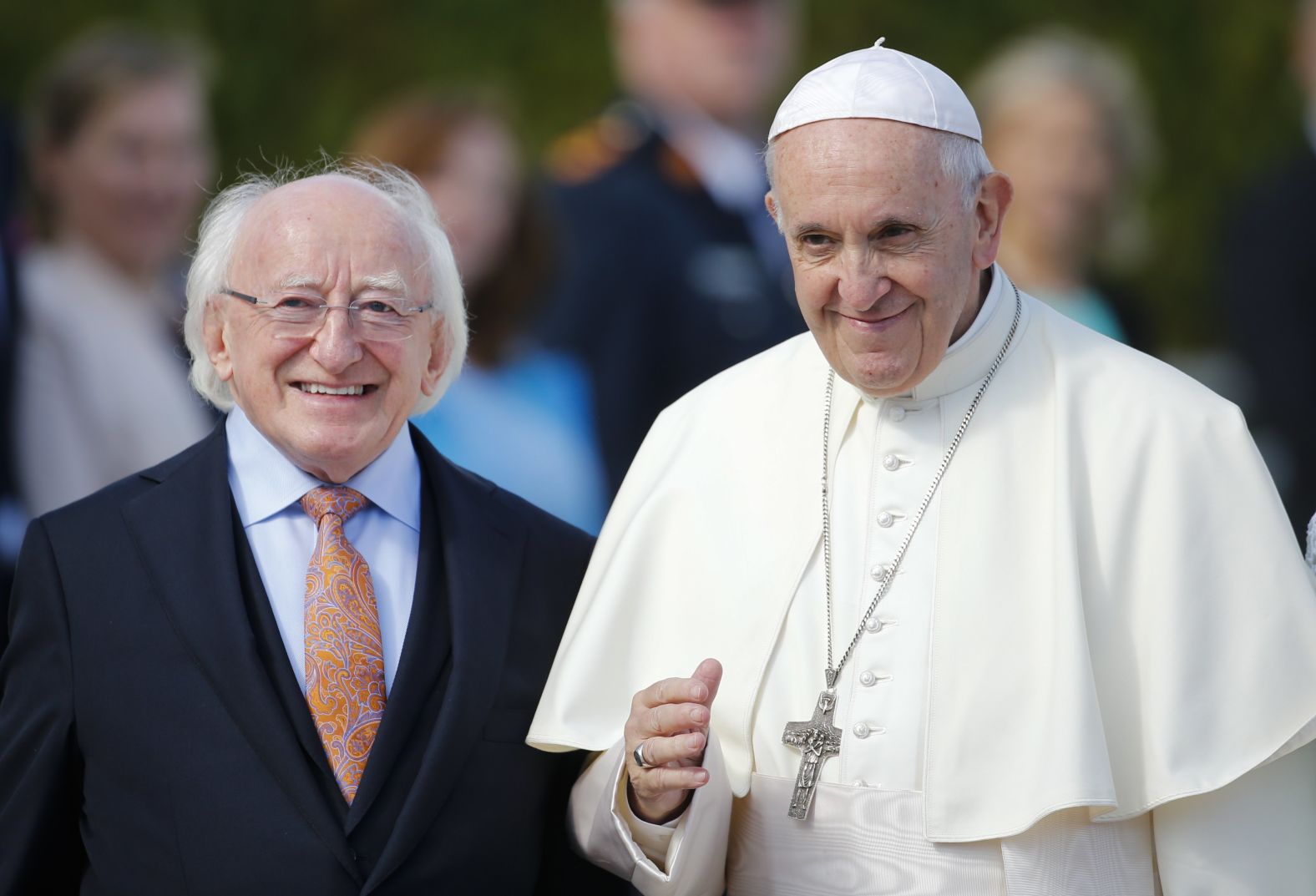 Pope Francis is flanked by Irish President Michael Higgins upon his arrival at the presidential residence in Dublin on Saturday.