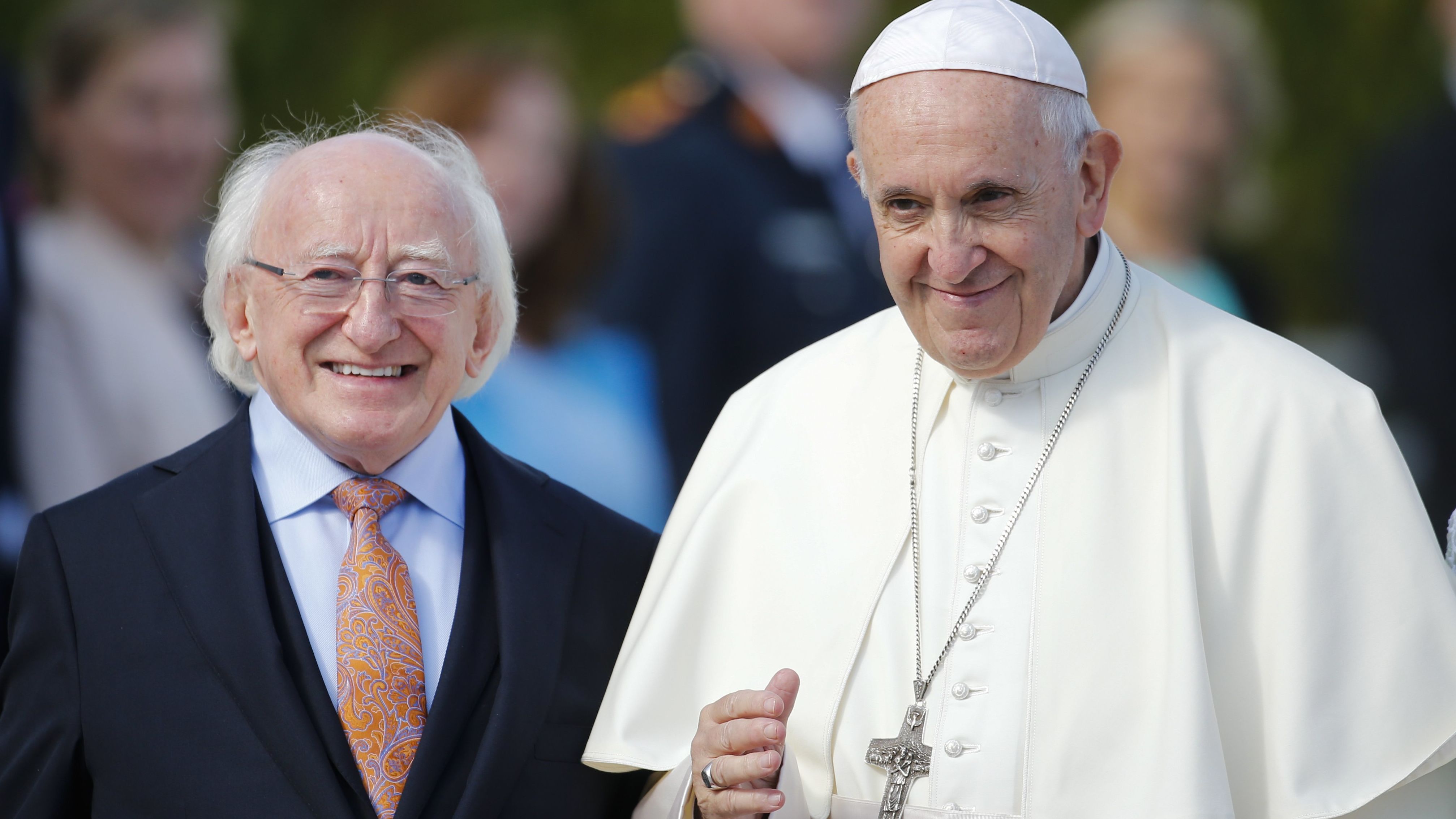 Pope Francis is flanked by Irish President Michael Higgins upon his arrival at the presidential residence in Dublin on Saturday.