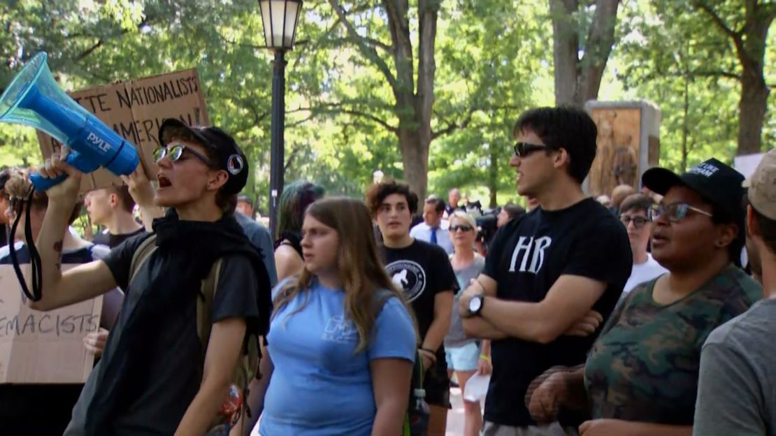 Demostrators gather near the site of the toppled statue on Saturday.