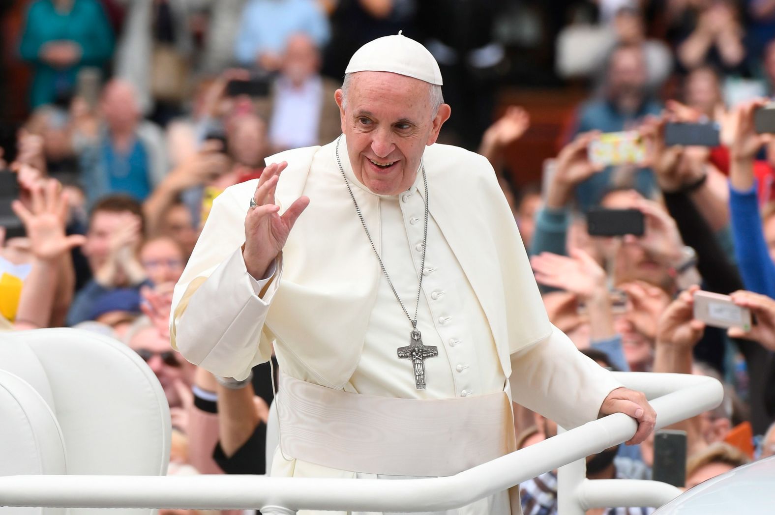 Pope Francis waves to the waiting crowds on College Green in Dublin on Saturday.