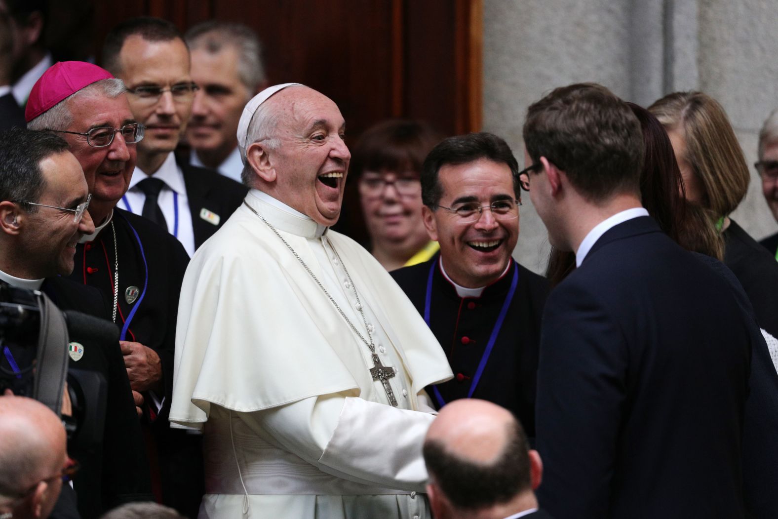 Pope Francis leaves St. Mary's Pro-Cathedral in Dublin after meeting recently married couples, and couples preparing for the Sacrament of Marriage, as part of his visit to Ireland.