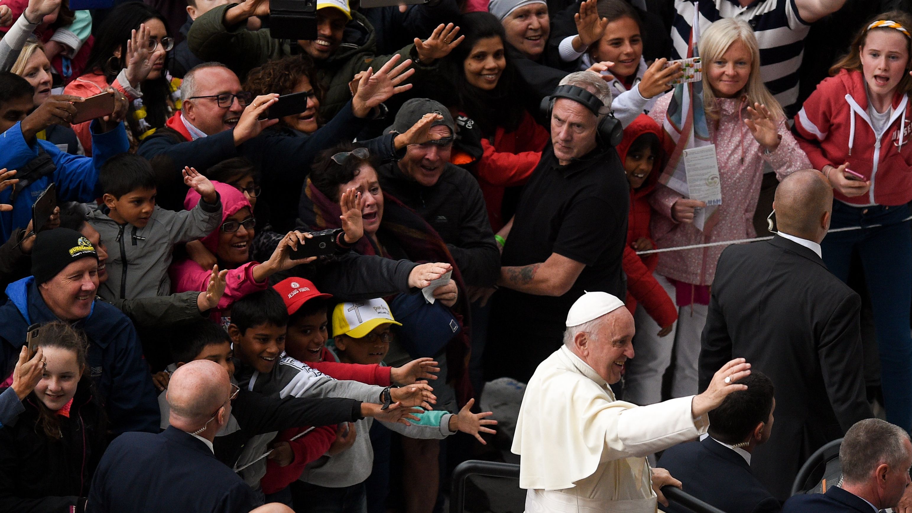 A crowd reacts to Pope Francis' arrival for the Festival of Families.