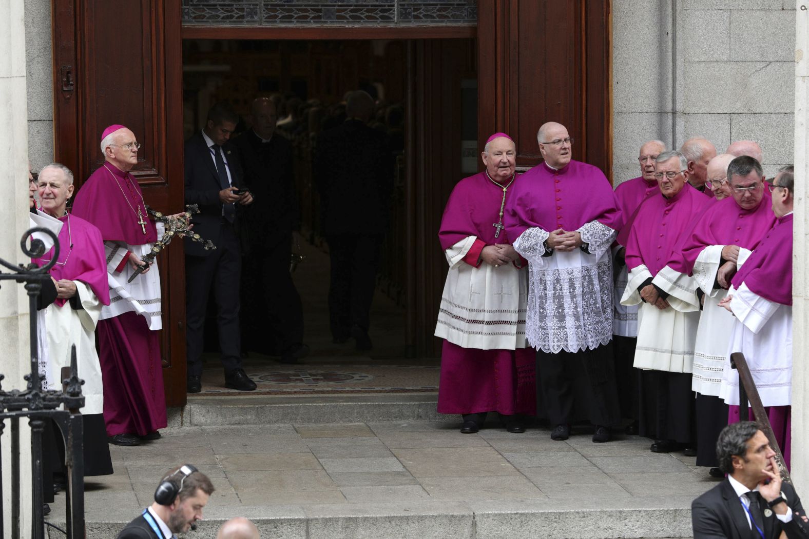 Priests await the arrival of Pope Francis at St. Mary's Pro-Cathedral.