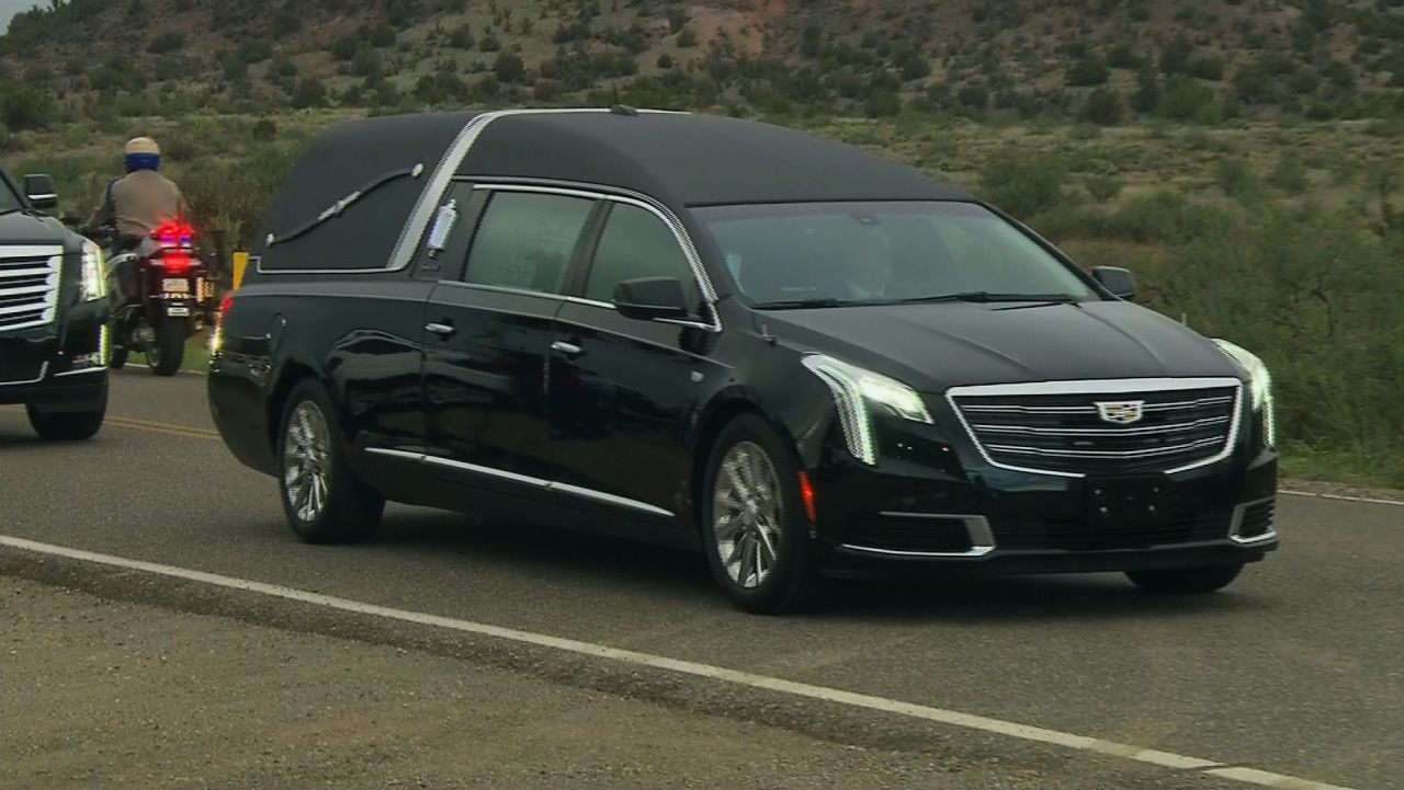 John McCain hearse enters ranch