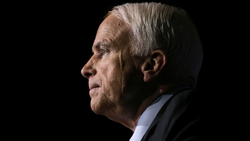 FILE -- In this Nov. 16, 2006, file photo Sen. John McCain, R-Ariz., pauses while speaking to the GOPAC Fall Charter Meeting in Washington. McCain's family said in a statement on Aug. 24, 2018, the Arizona senator has chosen to discontinue medical treatment for brain cancer. The 81-year-old McCain has been away from the Capitol since December. McCain's face bears a scar from skin cancer surgery in 2000. (AP Photo/J. Scott Applewhite, file)