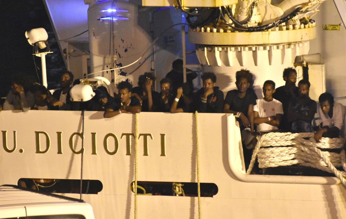 Migrants could be seen waiting to disembark overnight. 