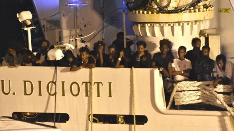 Migrants could be seen waiting to disembark overnight. 