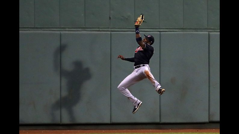 Cleveland's Greg Allen leaps for a catch against Boston on Tuesday, August 21.