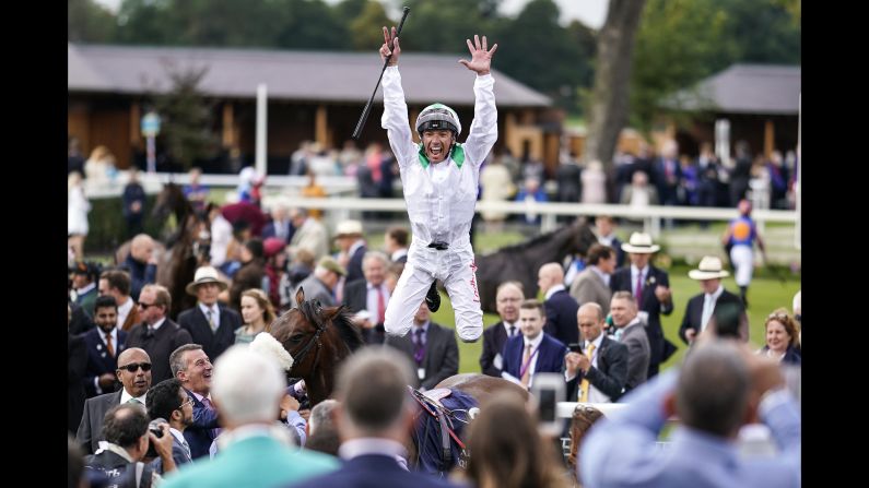 Jockey Frankie Dettori celebrates Friday, August 24, after riding Emaraaty Ana to victory in the Al Basti Equiworld Gimcrack Stakes in York, England.