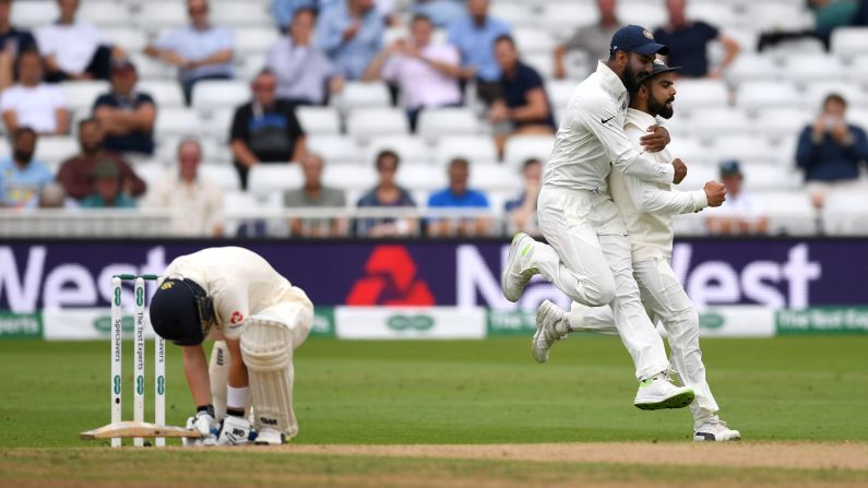 England's Ollie Pope reacts after he was caught out by India's Virat Hohli, right, during a Test match in Nottingham, England, on Tuesday, August 21. India won the match by 203 runs, but England won the other two Test matches they played this month.