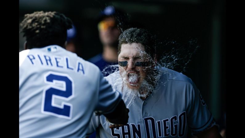 San Diego's Jose Pirela throws water into the face of teammate's Hunter Renfroe after Renfroe hit a home run in Denver on Thursday, August 23.