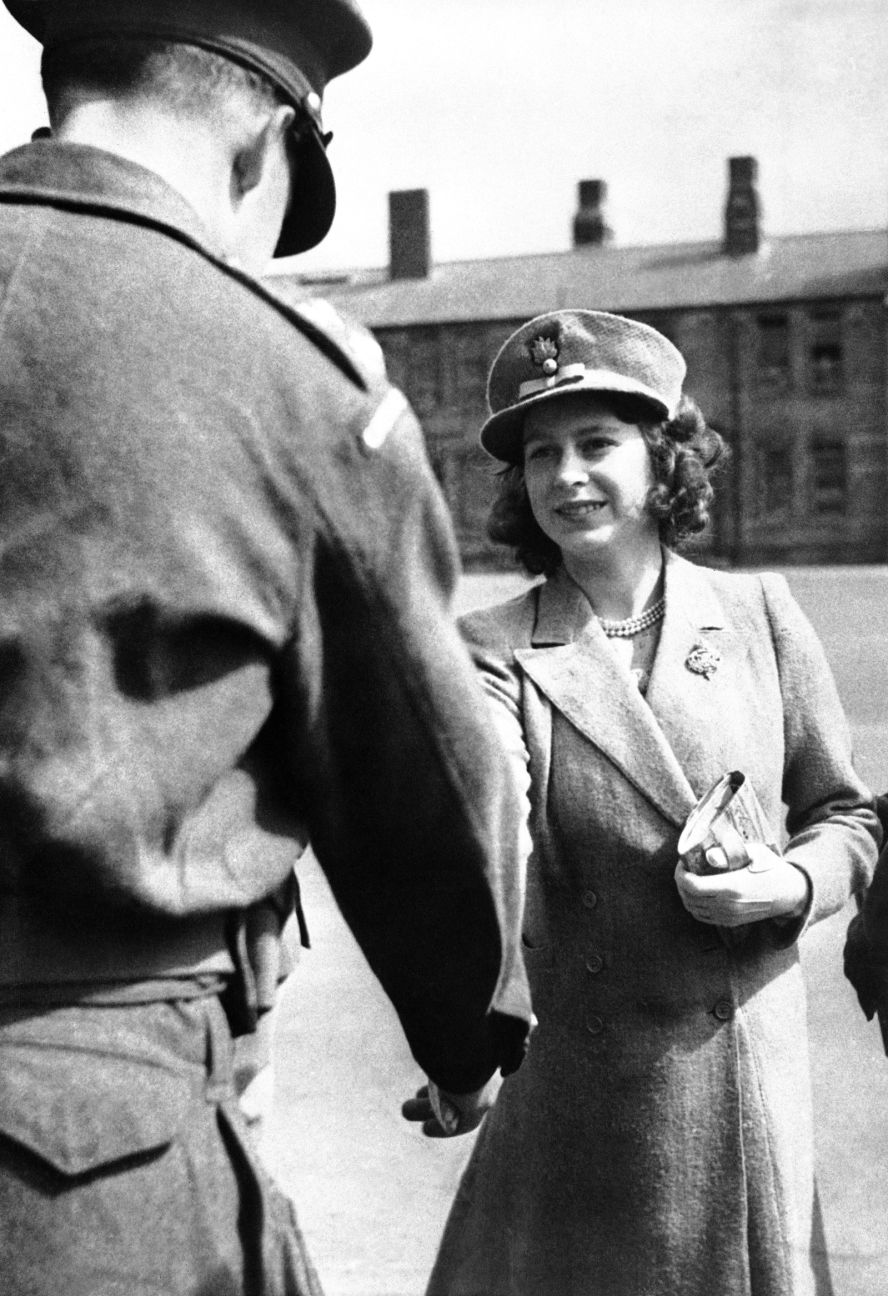 Princess Elizabeth shakes hands with an officer of the Grenadier Guards on May 29, 1942. King George VI made Elizabeth an honorary colonel in the Royal Army regiment.