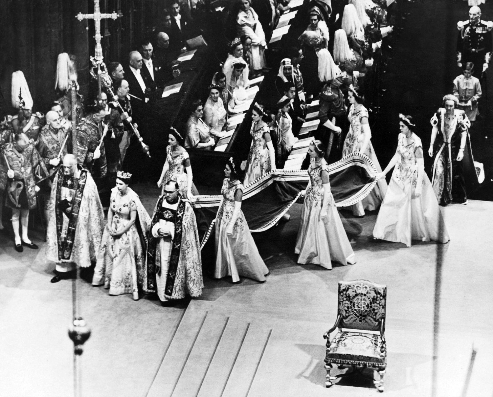 Elizabeth ascended to the throne in February 1952, when her father died of lung cancer at the age of 56. Here, she walks to the altar during her coronation ceremony on June 2, 1953.