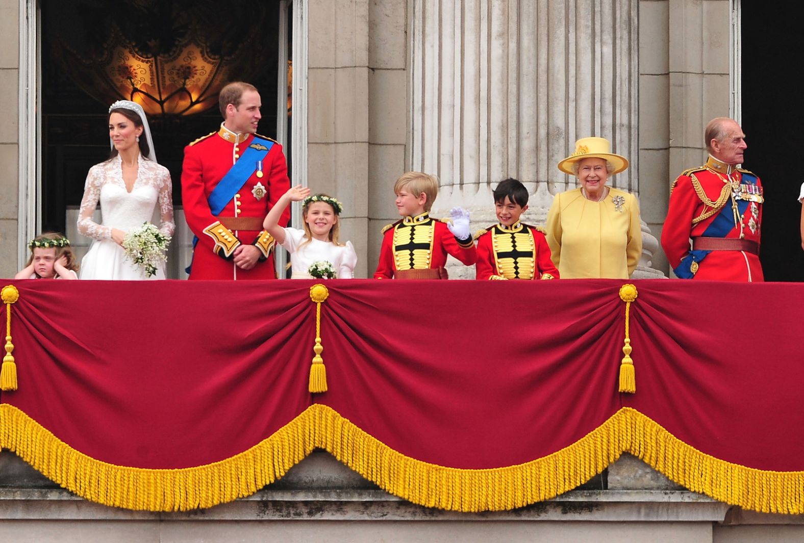 The Queen, second from right, greets a crowd from the balcony of Buckingham Palace in April 2011. Her grandson Prince William, third from left, had just married Catherine Middleton.