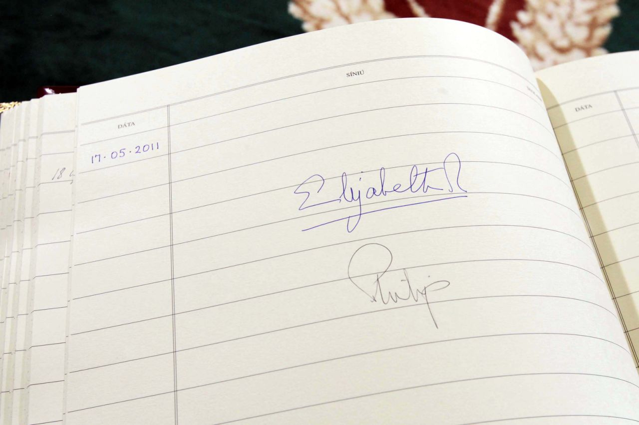 The Queen's signature is seen in the visitors book at Aras An Uachtarain, the Irish President's official residence in Dublin in May 2011.
