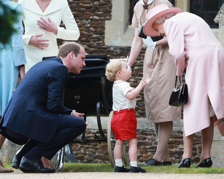 Elizabeth listens to her great-grandson, Prince George, outside a church where George's sister, Charlotte, was being christened in July 2015. George and Charlotte are the children of Prince William, left, and his wife, Catherine.