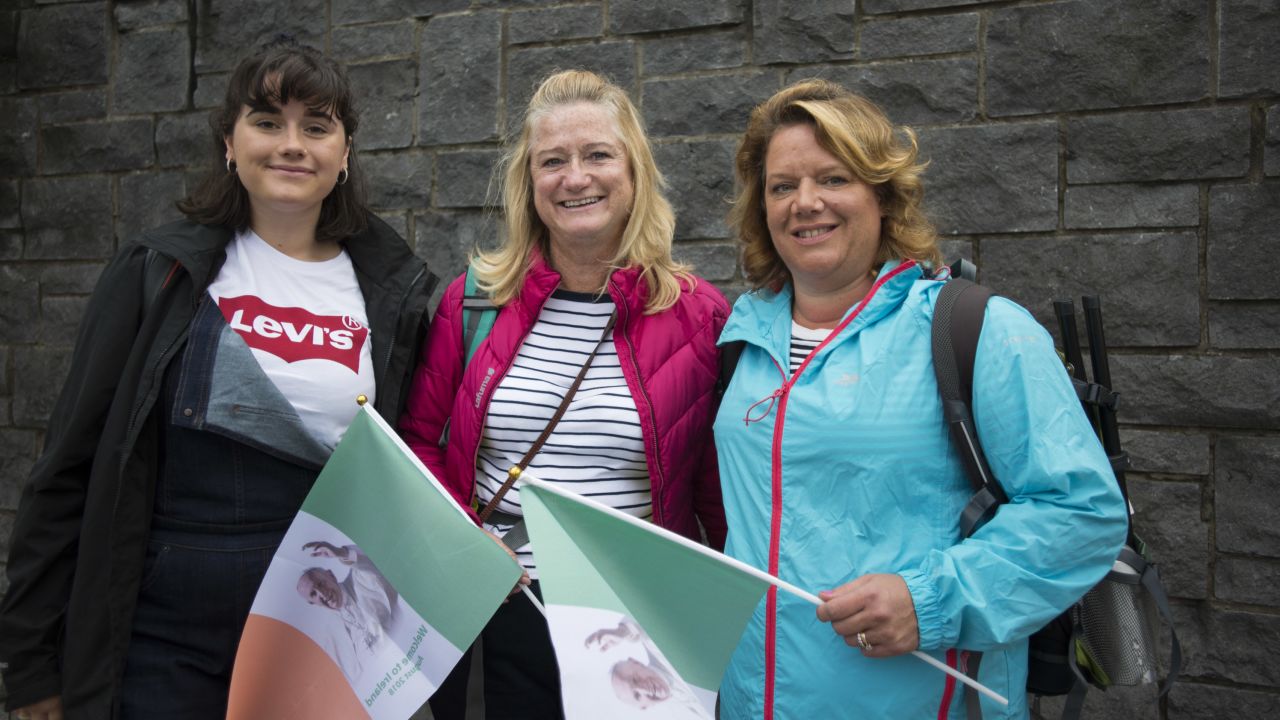 Aoibhin Meghen, 19, (left) with her mother Dearbhaile Heagney, 49, (right) and a friend on their way to the Papal Mass.