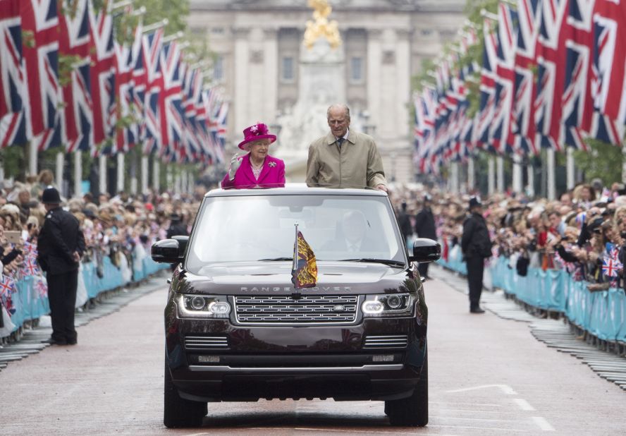 The Queen and Prince Philip wave to guests in London who were attending celebrations for her 90th birthday in 2016.