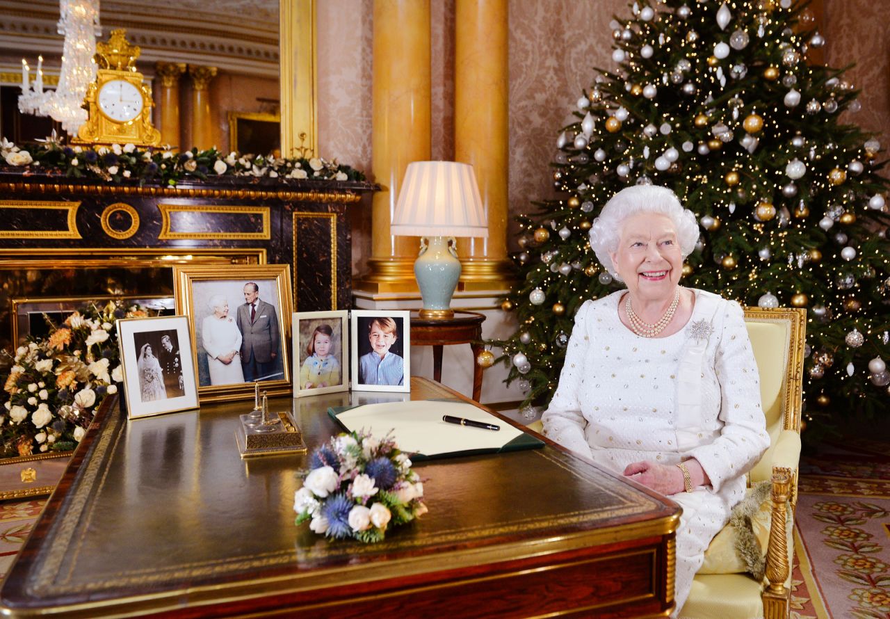 The Queen sits at a desk in Buckingham Palace after recording her Christmas Day broadcast in 2017.