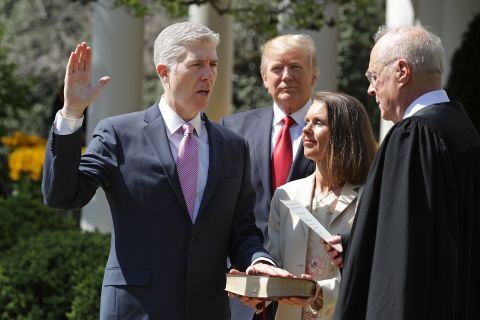 Trump watches as Supreme Court Justice Anthony Kennedy, right, administers the judicial oath to Neil Gorsuch during <a href="http://www.cnn.com/2017/04/10/politics/neil-gorsuch-trump/" target="_blank">a White House ceremony</a> in April 2017. Gorsuch was chosen by Trump to replace Supreme Court Justice Antonin Scalia, who died in 2016. Holding the Bible is Gorsuch's wife, Marie Louise.