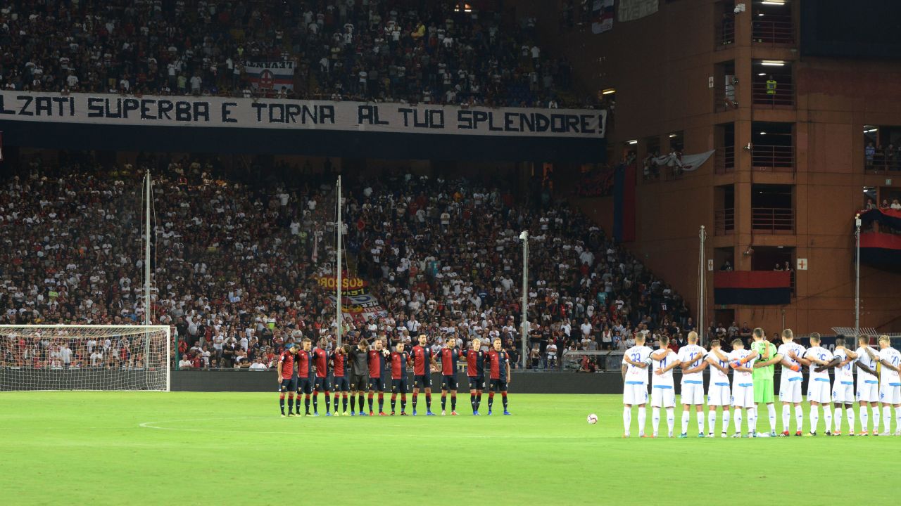 Players stand for a minute of silence to honor the 43 victims of the Genoa bridge collapse.