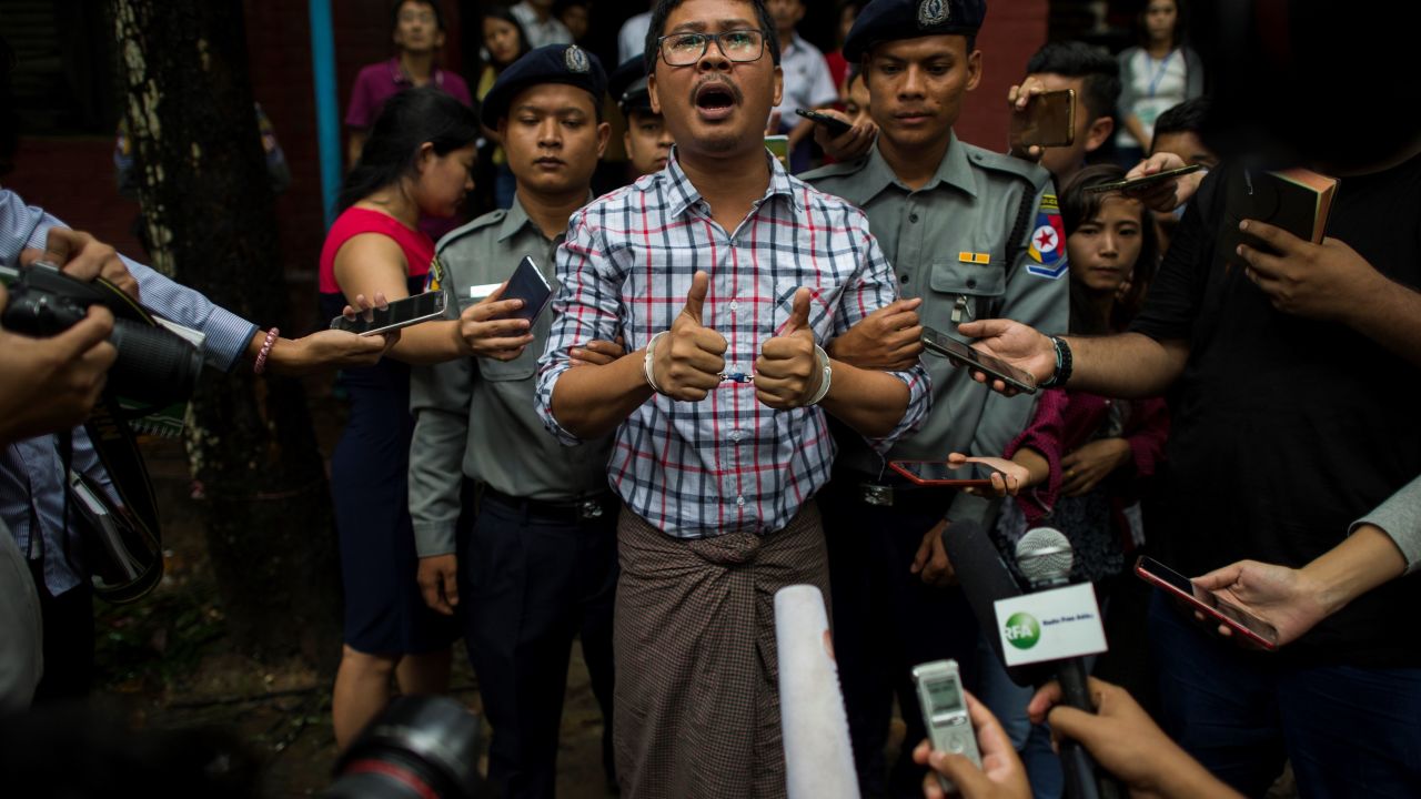 Detained Myanmar journalists Wa Lone speaks to journalist after appearing before a court trial in Yangon on August 20, 2018.