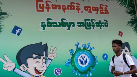 The Facebook logo is seen on an advertisement by a local telecom company in Yangon on June 7, 2018.