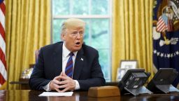 US President Donald Trump speaks on the phone with Mexico's President Enrique Pena Nieto on trade in the Oval Office of the White House in Washington, DC on August 27.