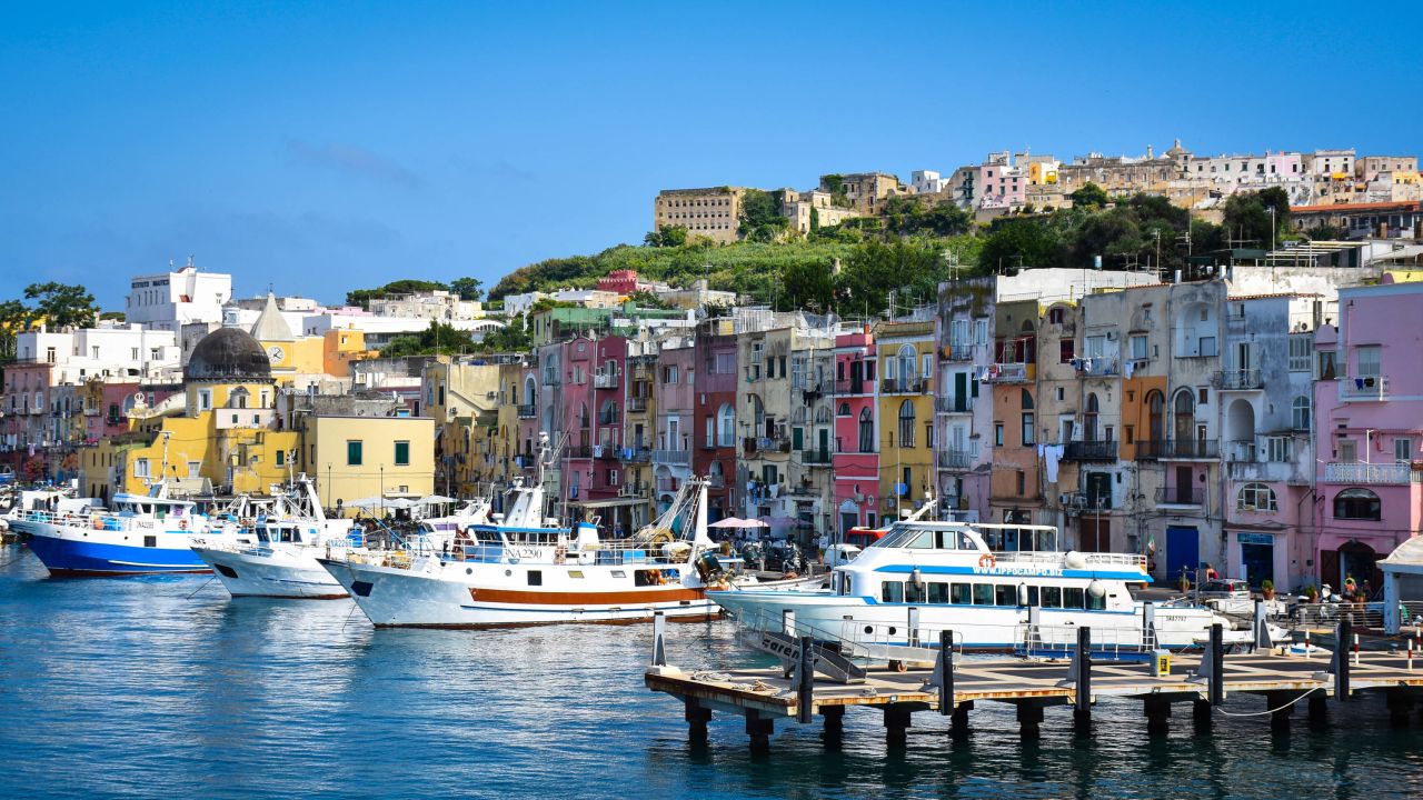 Ferries arriving in Procida are greeted by fishing boats and modest apartments.