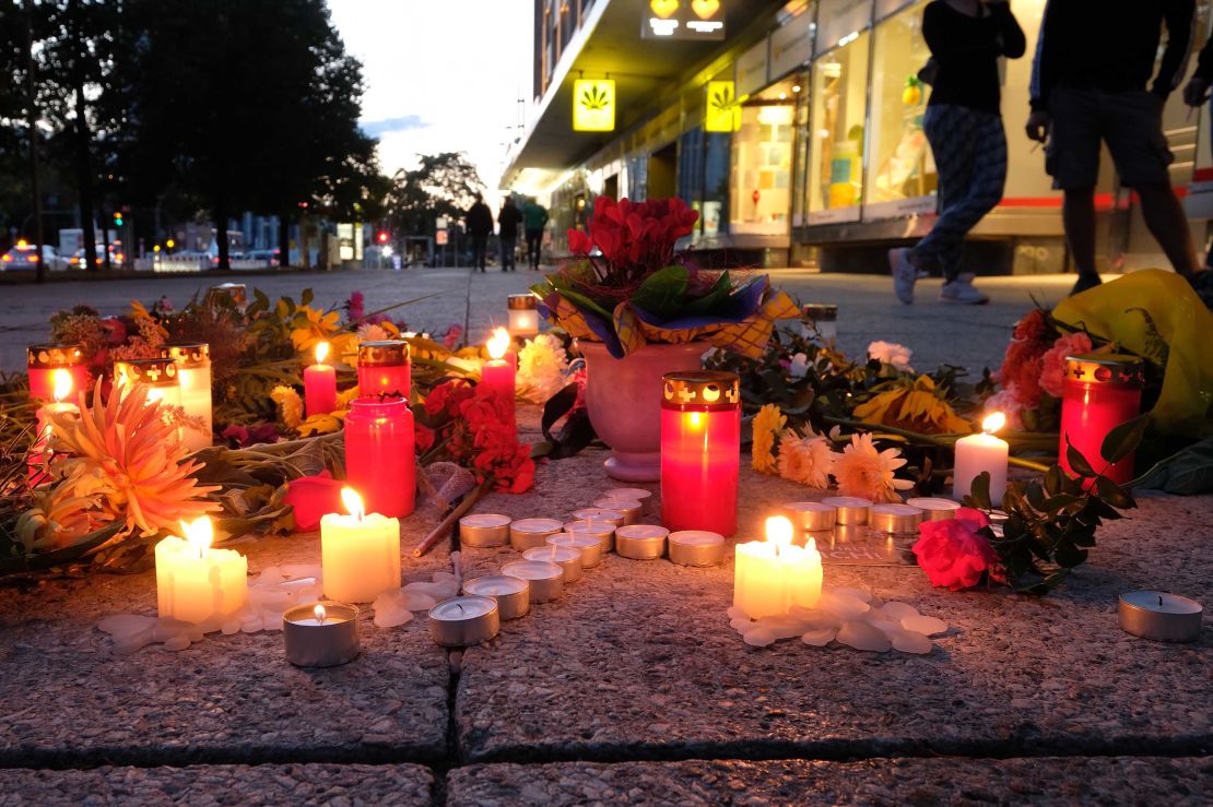 People display candles near the scene of the attack on the 35-year-old man, named by police only as Daniel H.