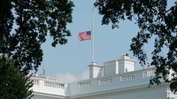 The flag above the White House flies at half staff in Washington, DC, on August 27, 2018.