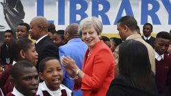 British Prime Minister Theresa May meets pupils during a visit at the the ID Mkhize High School in Gugulethu, Cape Town, South Africa, Tuesday, Aug. 28, 2018. Theresa May has started a three-nation visit to Africa where she is to meet South African President Cyril Ramaphosa. (AP Photo)